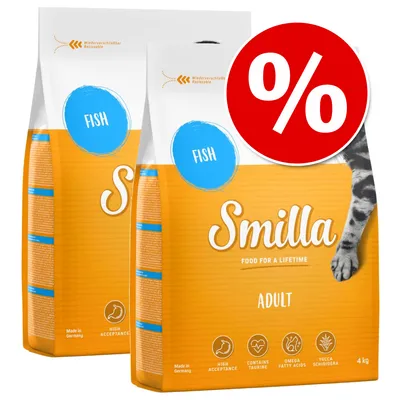Two bags of Smilla Adult Fish cat food, 4kg each, with visible icons for high acceptance, contains taurine, omega fatty acids, yucca schidigera. Red percentage discount symbol shown.