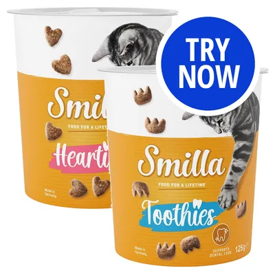 Two Smilla snack tubs labelled Hearties and Toothies, each with shaped treats and a cat image. Blue circle with white text reads 'Try Now'. Toothies tub states supports dental care.