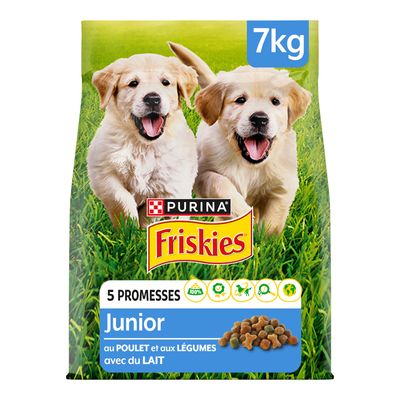 Confezione Purina Friskies Junior 7 kg, visibili due cuccioli, scritte: 5 promesse, Junior, au poulet et aux légumes avec du lait. Immagine crocchette e icone informative.