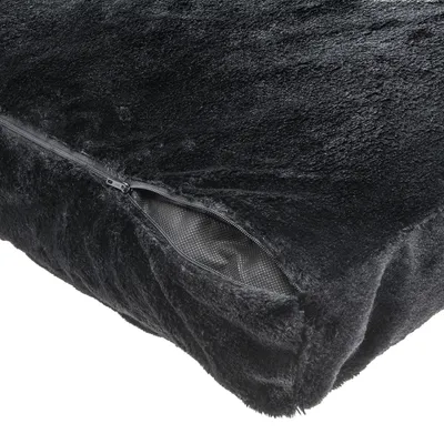 Black cover made of soft plush with visible zip and non-slip underside.