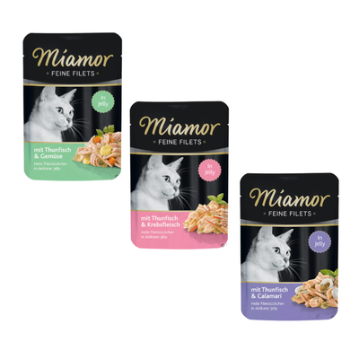 Miamor Feine Filets In Jelly, 18x saszetek. Widoczna saszetka: mit Thunfisch & Gemüse, jasne filety w galaretce. Na opakowaniu zdjęcie kota i kawałki tuńczyka z warzywami.
