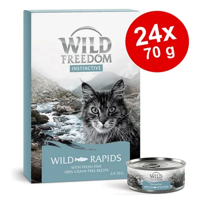 Wild Freedom Instinctive Wild Rapids, 24 x 70 g. Boîte et conserve visibles, mention 'with fresh fish', recette sans céréales, image de chat et rivière sur l'emballage.