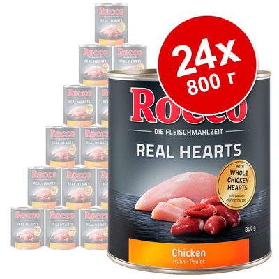 Консервы Rocco Real Hearts Chicken, 24×800 г. На упаковке изображены куриное филе и сердца, надпись: with whole chicken hearts. Видно несколько банок в наборе.