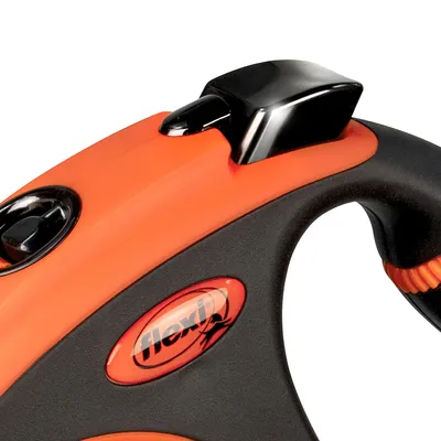 Flexi dog lead in black and orange with ergonomic handle and visible Flexi logo. Flexi dog lead in black and orange with ergonomic handle and visible Flexi logo.