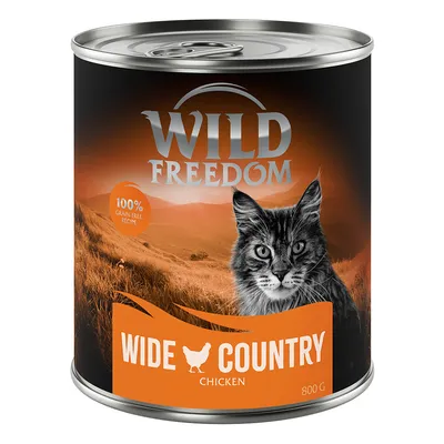 Boîte de pâtée pour chat Wild Freedom Wide Country Chicken 800 g, mention 100% grain-free recipe, image d’un chat et d’un paysage. Texte en anglais sur l’emballage.