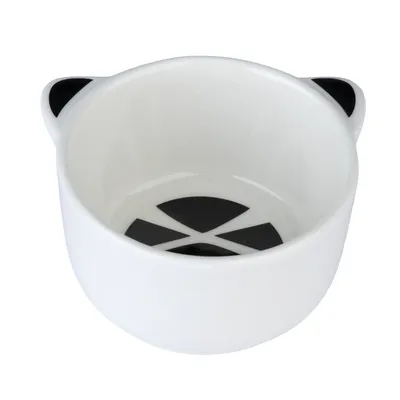 White ceramic bowl with black geometric patterns inside and ear design on the sides.