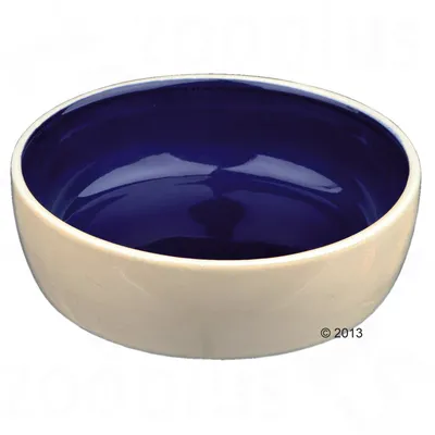 Cuenco redondo de cerámica con exterior beige y interior azul oscuro, sin marcas visibles ni decoración adicional.