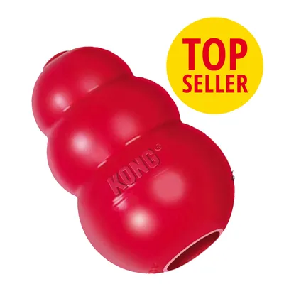 Czerwona zabawka KONG z widocznym napisem marki, obok żółte koło z tekstem TOP SELLER. Materiał: guma.