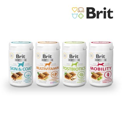 Brit Vitamins for Dogs Postbiotics, Made in EU, Lactobacillus helveticus, β-glükánok, inulin feliratú kutyavitaminos doboz, kocka alakú falatok képeivel.