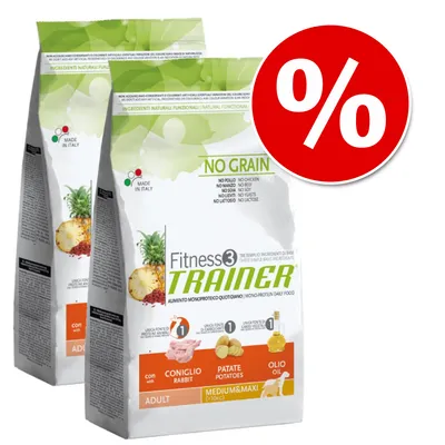 Dwie torby karmy Fitness3 Trainer No Grain dla psów, widoczne składniki: królik, ziemniaki, olej. Oznaczenie 'Made in Italy', duży symbol procentowy promujący ofertę.
