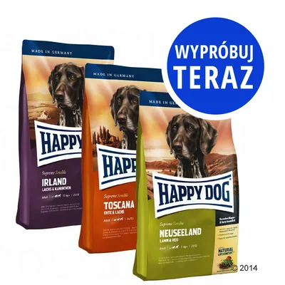 Trzy opakowania karmy Happy Dog: Irland Lachs & Kaninchen, Toscana Ente & Lachs, Neuseeland Lamm & Reis. Niebieskie koło z napisem: Wypróbuj teraz.