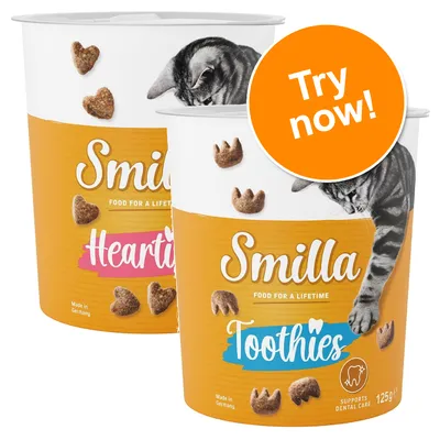 Smilla Hearties and Smilla Toothies cat treats tubs, 125g, with visible text: 'FOOD FOR A LIFETIME', 'Supports dental care', 'Made in Germany', orange badge reads 'Try now!'.