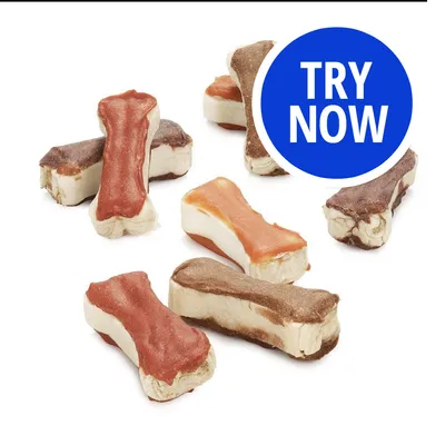 Assorted bone-shaped treats with a blue circle containing the text 'TRY NOW', indicating a promotional offer or sample opportunity. Assorted bone-shaped treats with a blue circle containing the text 'TRY NOW', indicating a promotional offer or sample opportunity.