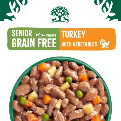 Senior grain free food for 7+ years, turkey with vegetables. Image shows bowl of meaty chunks with peas, carrots and potatoes in gravy.