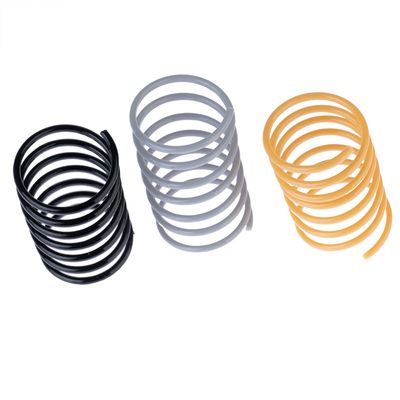 Three spiral springs in black, grey and yellow. Suitable for toys or accessories.