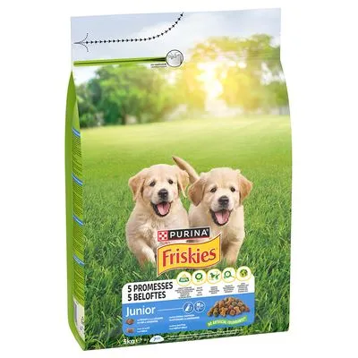 Purina Friskies Junior hondenvoer, verpakking met afbeelding van twee puppy’s op gras. Tekst: 5 beloftes, Junior, 3 kg. Afbeelding van brokjes en pictogrammen zichtbaar.
