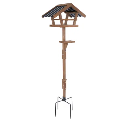 Vogelhaus aus Holz mit schwarzem Dach, auf einem stabilen Metallständer mit vier Beinen. Geeignet für den Garten oder Aussenbereich.