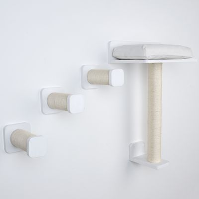 Wall-mounted scratching post set with three sisal scratching posts and a padded lying surface in white.