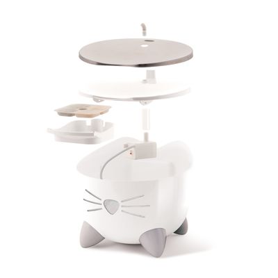 Exploded view of a white drinking fountain with cat motif, showing removable parts: stainless steel plate, filter insert and water container.