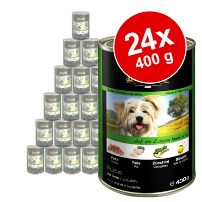 Lot de 24 boîtes Belcando 400 g, étiquette indiquant : Pute (volaille), Reis (riz), Zucchini (courgettes), Distelöl (huile de chardon), avec riz et courgettes. Super Premium Quality.