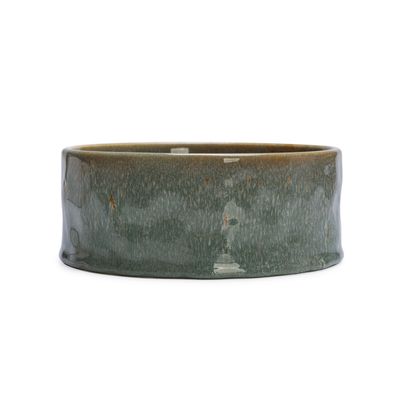 Ceramic bowl with greenish glaze, round and without visible brand marking.