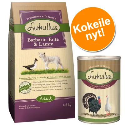 Lukullus Barbarie-Ente & Lamm -koiranruokapakkaus 1,5 kg ja Lukullus Purtenherzen & Gans -koiranruokasäilyke. Oranssi merkki: Kokeile nyt!