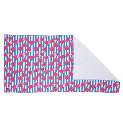 Blanket with colourful watermelon pattern on blue and white striped background, reverse side in white.