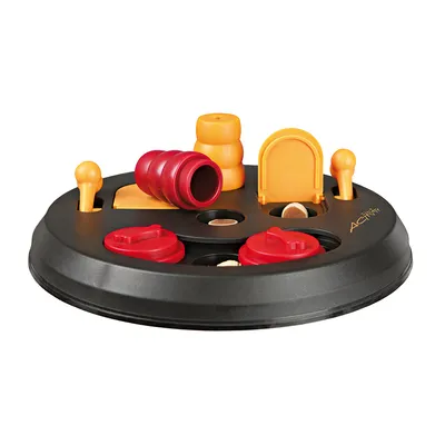Gioco interattivo per animali Trixie Dog Activity, base rotonda nera con elementi mobili rossi e arancioni in plastica, scomparti visibili con crocchette all'interno.