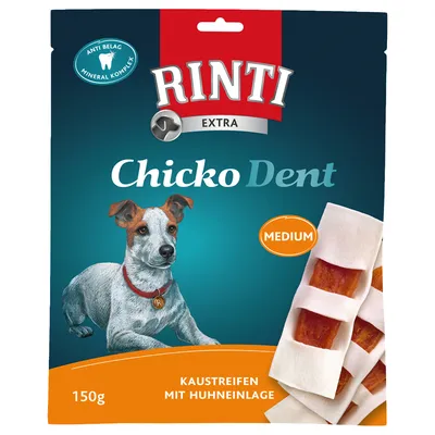Упаковка Rinti Extra Chicko Dent Medium, 150 г. Видны жевательные полоски с курицей. Текст на немецком: Kaustreifen mit Huhneinlage. Значок Anti Belag Mineral Komplex.