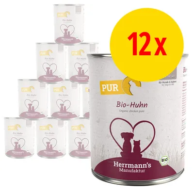 Lot de 12 boîtes Herrmann's Manufaktur PUR Bio-Huhn, texte visible : pour chiens et chats, Bio, illustration chien et chat dans un cœur. Étiquette en allemand.