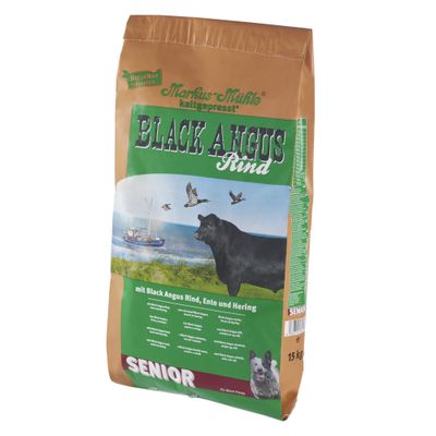 Markus-Mühle Black Angus Rind Senior, kaltgepresst, mit Rind, Ente und Hering. Für ältere Hunde. Verpackung zeigt Landschaft mit Küste, Schiff und Tiere. Gewicht: 15 kg.