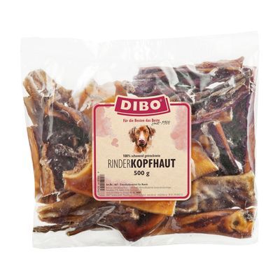 Zak DIBO Rinderkopfhaut 500 g, transparante verpakking met zichtbaar gedroogde runderhuidstukken. Etiket vermeldt: 100% schoneid getrocknete RinderKOPFHAUT 500 g.