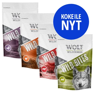 Wolf of Wilderness Grain Free Snack -pussit eri makuina, edessä Wild Bites Green Fields. Sininen ympyrä: KOKEILE NYT.