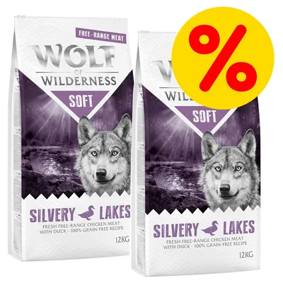 Wolf of Wilderness Soft Silvery Lakes, carne de pollo campero con pato, receta sin cereales, 2 sacos de 12 kg. Símbolo de porcentaje en círculo amarillo indica oferta.