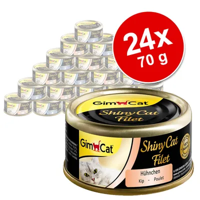 GimCat ShinyCat Filet Hühnchen, zestaw 24 puszek po 70 g. Widoczna etykieta z nazwą produktu i zdjęciem kota.