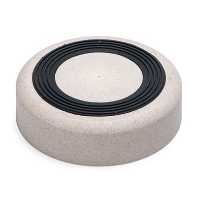 Round feeding bowl made of beige-coloured material with a black non-slip ring on the top.