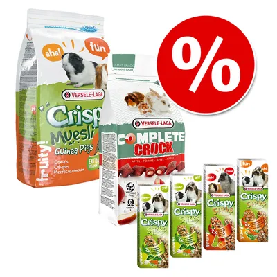 Flera förpackningar Versele-Laga marsvinsfoder: Crispy Muesli, Complete Crock och Crispy Sticks. Stor röd procent-symbol visar rabatt eller kampanj.