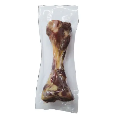 Osso naturale confezionato sottovuoto in plastica trasparente, senza etichette o testo visibile.