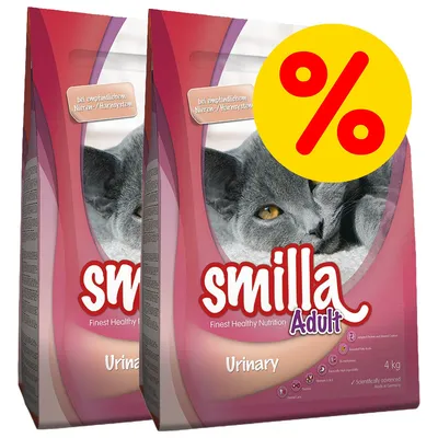 Twee zakken Smilla Adult Urinary kattenvoer 4 kg, met afbeelding van een grijze kat en groot geel kortingssymbool (%). Tekst op verpakking deels in het Duits.