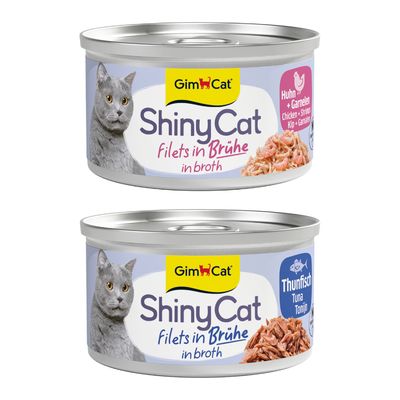 GimCat ShinyCat Filet Hühnchen, zestaw 24 puszek po 70 g. Widoczna etykieta z nazwą produktu i zdjęciem kota.