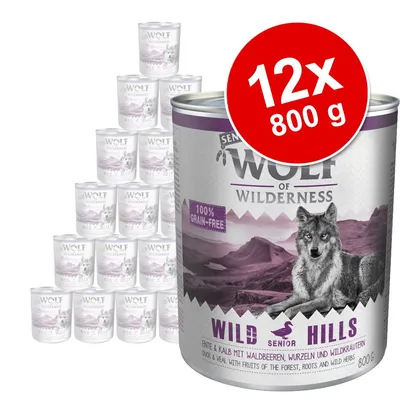 Wolf of Wilderness Wild Hills Senior, 12×800 g konzerv. Viditelný nápis: 100% grain-free. Kachna a telecí s lesními plody, kořeny a bylinkami.