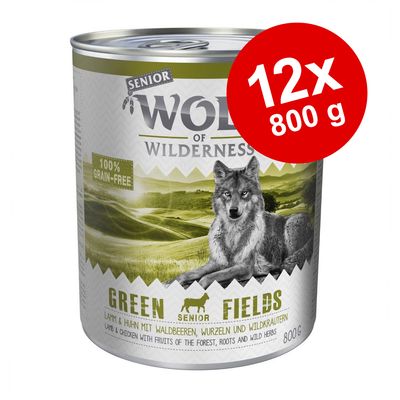 Wolf of Wilderness Senior Green Fields, 12x800 g, 100% grain-free. Text: lamm & kyckling med skogsbär, rötter och vilda örter. Bild på varg och landskap på burken.