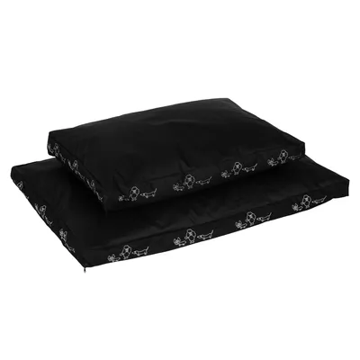 Deux coussins noirs pour animaux, rectangulaires, avec motifs blancs de chiens sur les côtés. Matière textile visible. Aucun texte ou marque apparente.
