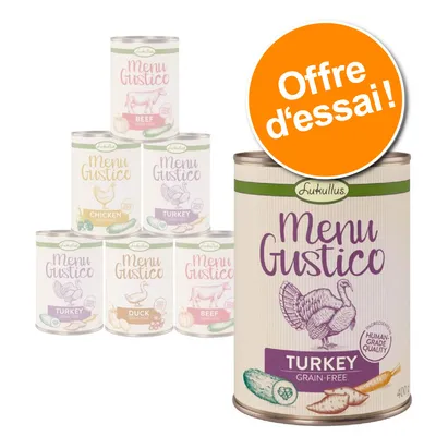 Boîtes Lukullus Menu Gustico, variétés visibles : Turkey, Beef, Chicken, Duck. Texte sur la boîte : 'Menu Gustico', 'Turkey grain-free', 'Human-grade quality'. Pastille : Offre d’essai !