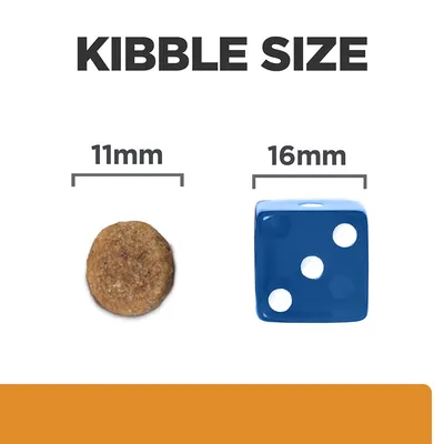 Kibble size comparison showing a round kibble measuring 11mm next to a blue die measuring 16mm.