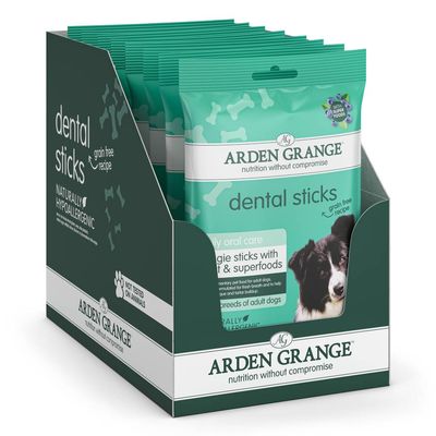 Display box of dental sticks with grain free recipe, naturally hypoallergenic, not tested on animals, and superfoods highlighted on the packaging.