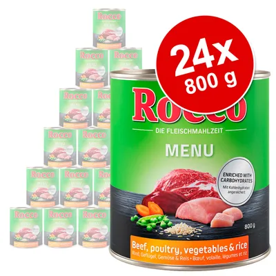 Консервы Rocco Menu, 24 банки по 800 г. На упаковке: говядина, птица, овощи и рис. Надпись: Enriched with carbohydrates. Видны изображения мяса, овощей и риса.