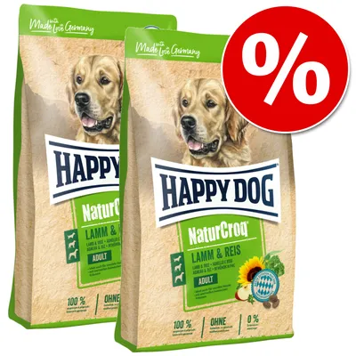 Happy Dog NaturCroq Lamb & Rice Adult. Made in Germany, 100% natural ingredients, no added sugar, suitable for adult dogs. Percent sign for discount promotion visible.