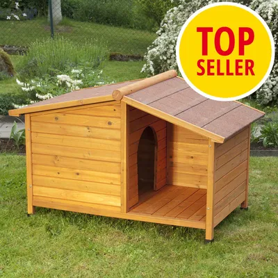 Hundkoja i trä med öppning framtill, synlig etikett med texten 'TOP SELLER' i gul cirkel uppe till höger.