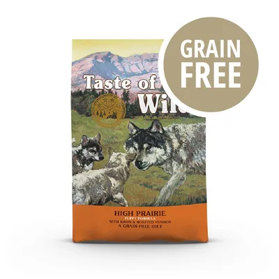 Confezione Taste of the Wild High Prairie Puppy Formula with Bison & Roasted Venison, scritta visibile 'GRAIN FREE' su cerchio marrone.